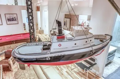 a boat on display in a room at Old Port Elegance and Designer Loft with PV Terrace in Montréal