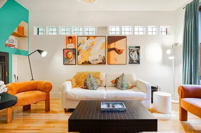 a living room with a couch and a table at Unique Downtown Montreal Stay with Private Terrace in Montréal