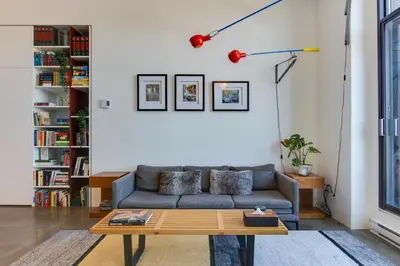 a living room with a couch and a coffee table at Modern Design - Newly renovated apartment with a view and parking in Montréal