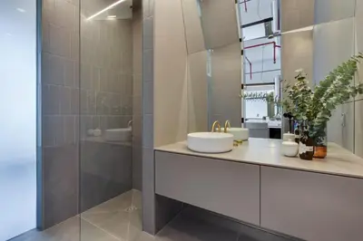 a bathroom with a sink and a shower at Modern Design - Newly renovated apartment with a view and parking in Montréal
