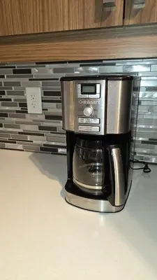 a coffee maker sitting on top of a coffee machine at Cozy Digital Nomad Apartment in Montreal Riv-Sud in Brossard