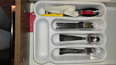 a white tray with some kitchen utensils in it at Cozy Digital Nomad Apartment in Montreal Riv-Sud in Brossard