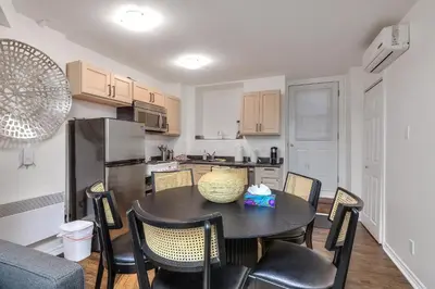 a kitchen and dining room with a table and chairs at Fox Aparthotel - Palais Des Congres in Montréal