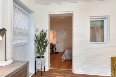a hallway with a white brick wall at Fox Aparthotel Palais Des Congres V in Montréal