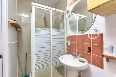 a bathroom with a sink and a shower at Fox Aparthotel Palais Des Congres V in Montréal