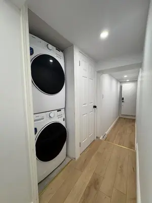 a laundry room with two washer and dryer at Modern Studio-Patio & BBQ-Parking Included in Montréal