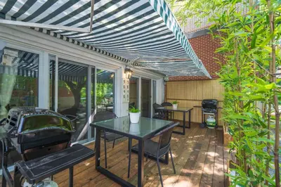 a patio with a table and chairs on it at Modern Studio-Patio & BBQ-Parking Included in Montréal