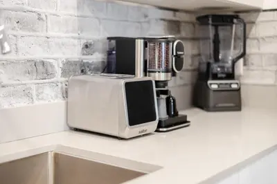 a microwave sitting on top of a kitchen counter at Theatre Hotel by Lodgo in Montréal