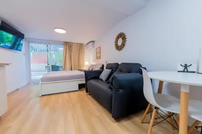 a living room with a couch and a table at Renovated Studio w Parking Queen Bed and Sofa Bed in Montréal