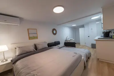 a bedroom with a large bed in a room at Renovated Studio w Parking Queen Bed and Sofa Bed in Montréal