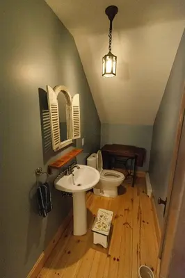 a bathroom with a sink and a toilet at Mirror Lakefront and SPA - A Fleur D'eau in Dudswell