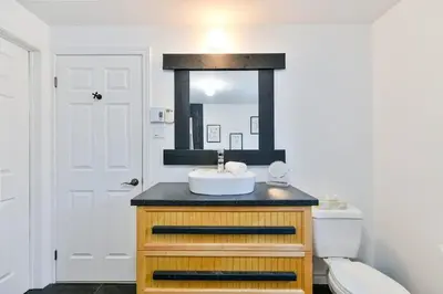 a bathroom with a sink and a toilet at Suite 3 - Val-Racine in Notre-Dame-Des-Bois