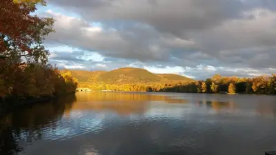 a view of a river with trees and mountains at Bright 2BR Near River Private Parking in McMasterville