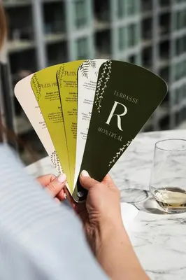 a person holding up a piece of paper with a ticket at Renaissance Montreal Downtown Hotel in Montréal
