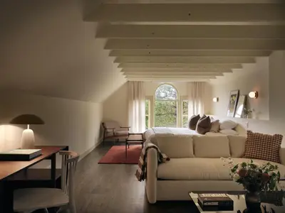 a living room with a couch and a table at Pinôt Boutique Hôtel in Sutton