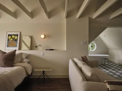 a living room with a couch and a table at Pinôt Boutique Hôtel in Sutton