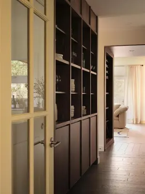 a door leading into a dining room with a wine cellar at Pinôt Boutique Hôtel in Sutton