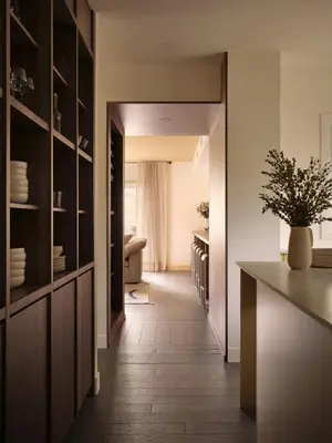 a kitchen with a counter and a table with a plant at Pinôt Boutique Hôtel in Sutton