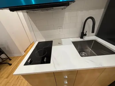 a kitchen counter top with a sink and a sink at 1 bedroom apartment near Montreal downtown with parking in Montréal