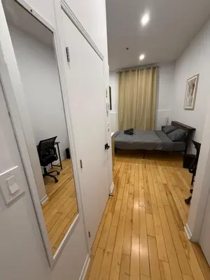 a hallway with a door leading to a bedroom at 1 bedroom apartment near Montreal downtown with parking in Montréal