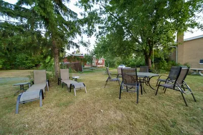 a group of chairs and tables in a yard at 3 bedrooms in Brossard,mins to REM station,hwy in Brossard