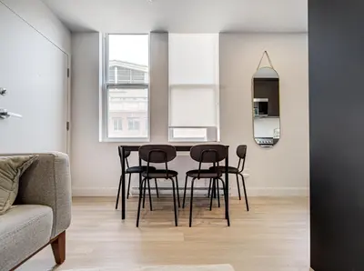 a dining room with a table and chairs at Stunning 2 Bedroom Downtown Montreal in Montréal