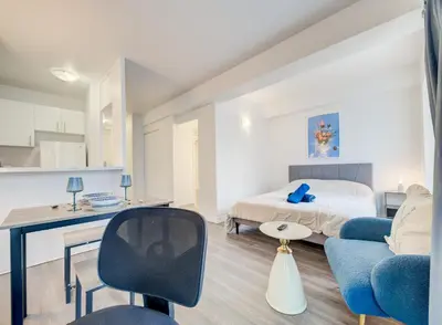 a bedroom with a bed and a desk and a couch at Elegant Studio in DT MTL AC, Wi-Fi in Montréal