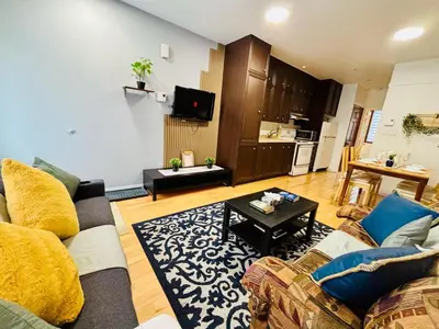 a living room with a couch and a table at Sunrise Haven in Montréal