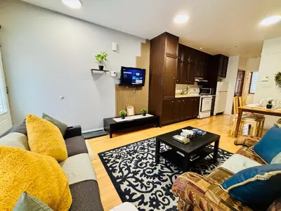 a living room with a couch and a table at Sunrise Haven in Montréal