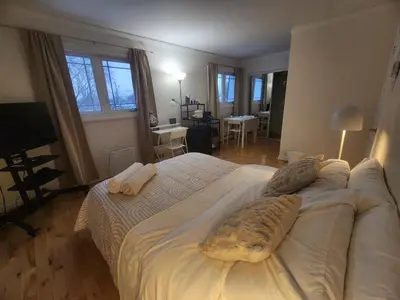 a bedroom with a large bed with two pillows on it at Chambre Zen, Résidence paisible près de Montréal in Longueuil