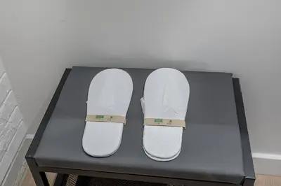a pair of white shoes sitting on a table at Downtown Core - Ultra Modern 1 Bedroom Apartment in Montréal
