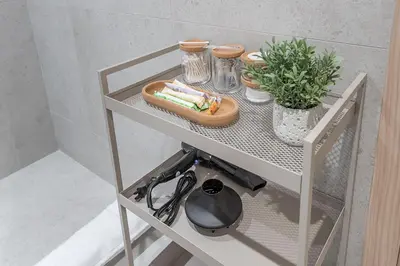 a white shelf with a plate of food on it at Downtown Core - Ultra Modern 1 Bedroom Apartment in Montréal