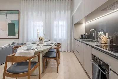 a kitchen with a table and chairs in a kitchen at Luxury 4BR 3BA Penthouse with Private Terrace in Montréal