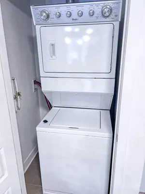 a white washer and dryer in a room at Downtown Elite Residences in Montréal