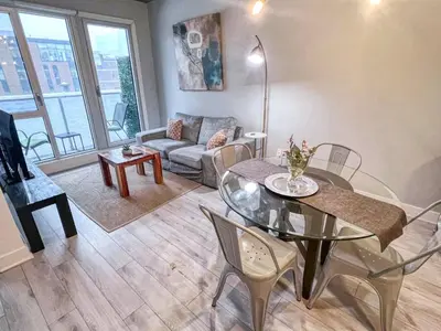 a living room with a table and a couch at Downtown Elite Residences in Montréal