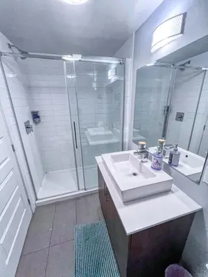a bathroom with a shower and a sink and a shower at Downtown Elite Residences in Montréal