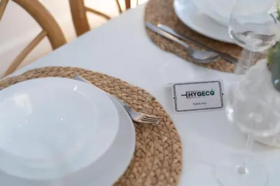 a white plate on a table with a sign on it at Spacious Apartment in Old Port Montreal in Montréal