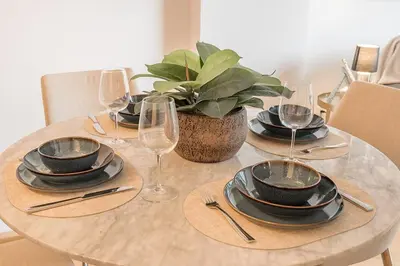 a table with plates and wine glasses on it at Old Port Upscale - Free Indoor Parking in Montréal