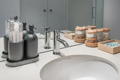 a bathroom counter with a sink and a mirror at Old Port Upscale - Free Indoor Parking in Montréal