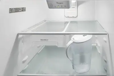 a white refrigerator with a glass shelf in it at Old Port Upscale - Free Indoor Parking in Montréal