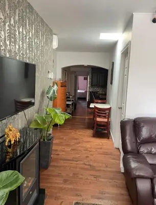 a living room with a couch and a table at 2 Beds availabe and self service small breakfast in Montréal