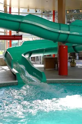 a water slide in a pool in a mall at Armon Plaza Montreal Airport in Saint-Laurent