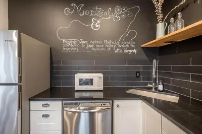 a kitchen with a sink and a microwave at Modern 2BR - 2 Full Bathrooms - Trendy Location in Montréal