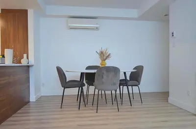 a dining room with a table and chairs at Urban Serenity NDG in Montréal