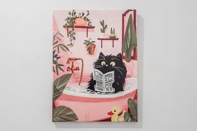 a cat sitting in a bathtub in a pink bathroom at Skyline Suite - Modern 1 BR in Montréal
