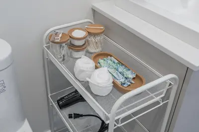 a shelf with dishes and other items in a kitchen at Cozy Corner - Modern 1BR in MTL in Montréal