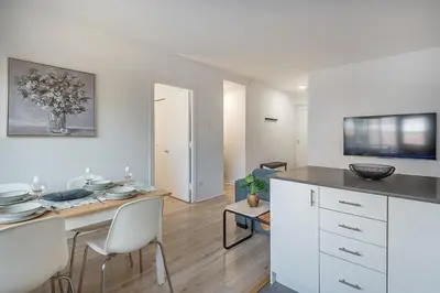 a kitchen with a table and chairs in a room at The Nest - Comfy 1 bedroom in Prime Location in Montréal