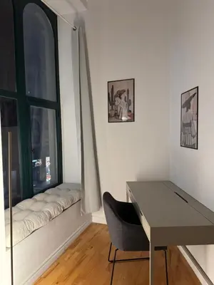 a desk and a chair in a room with a window at Top Location - The 777 Old Port Gem in Montréal