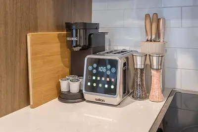 a toaster sitting on top of a kitchen counter at Cute Gem in Downtown Montreal in Montréal