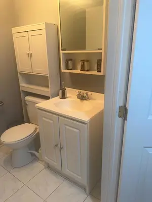 a bathroom with a white sink and a toilet at Perfect location brand new basement 1 bedroom full basement with kitchen in unit laundry separated in Laval